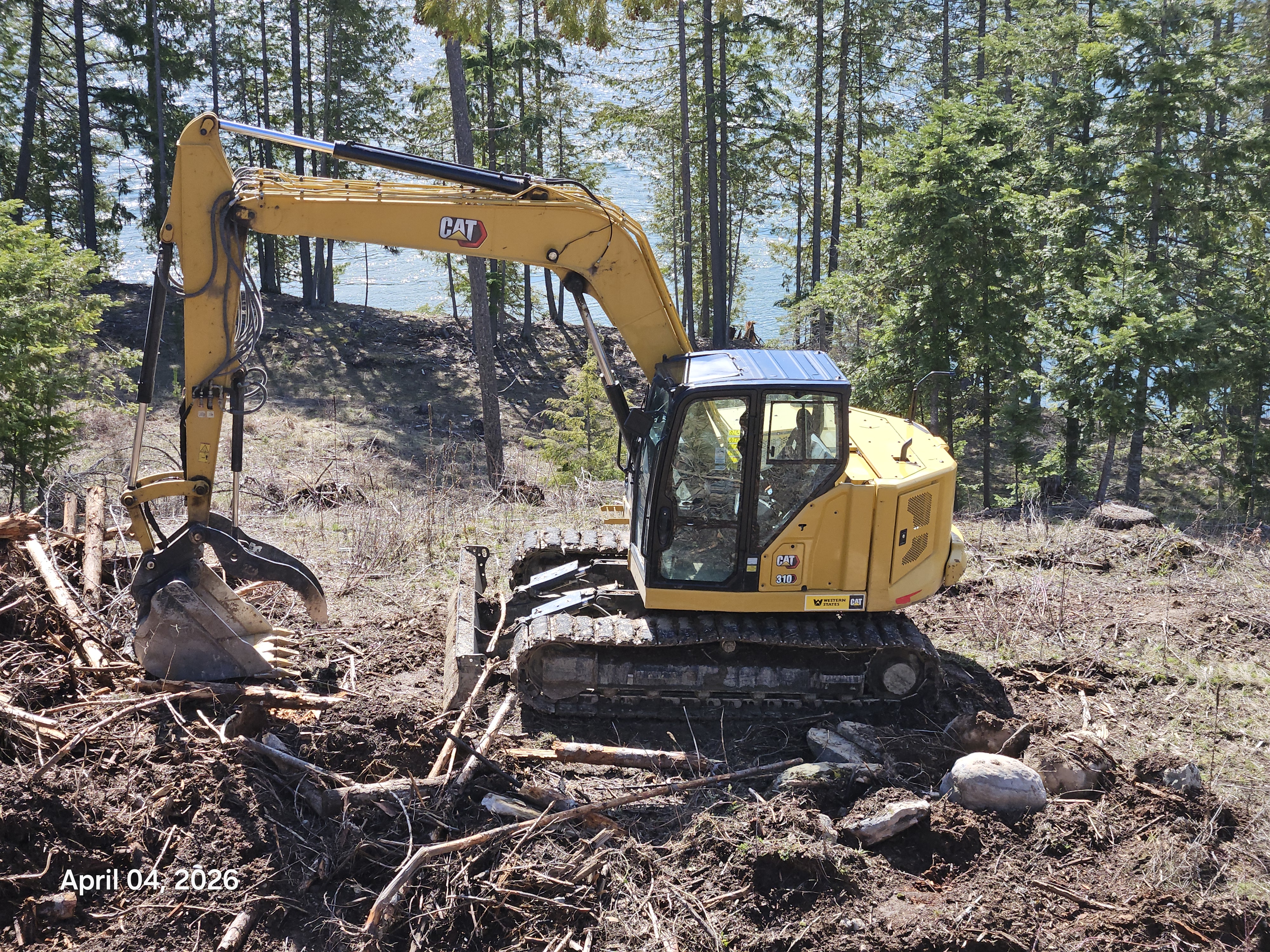 CAT 310 mid-size excavator on Idaho job site
